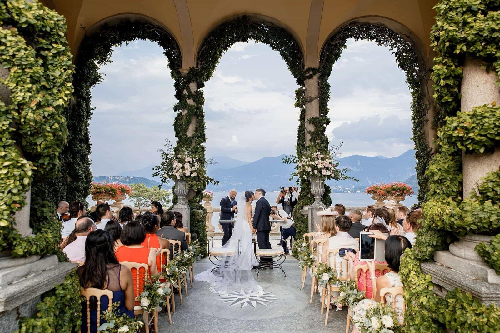 Guests seated for a wedding ceremony on the terrace of Villa del Balbianello, Lake Como