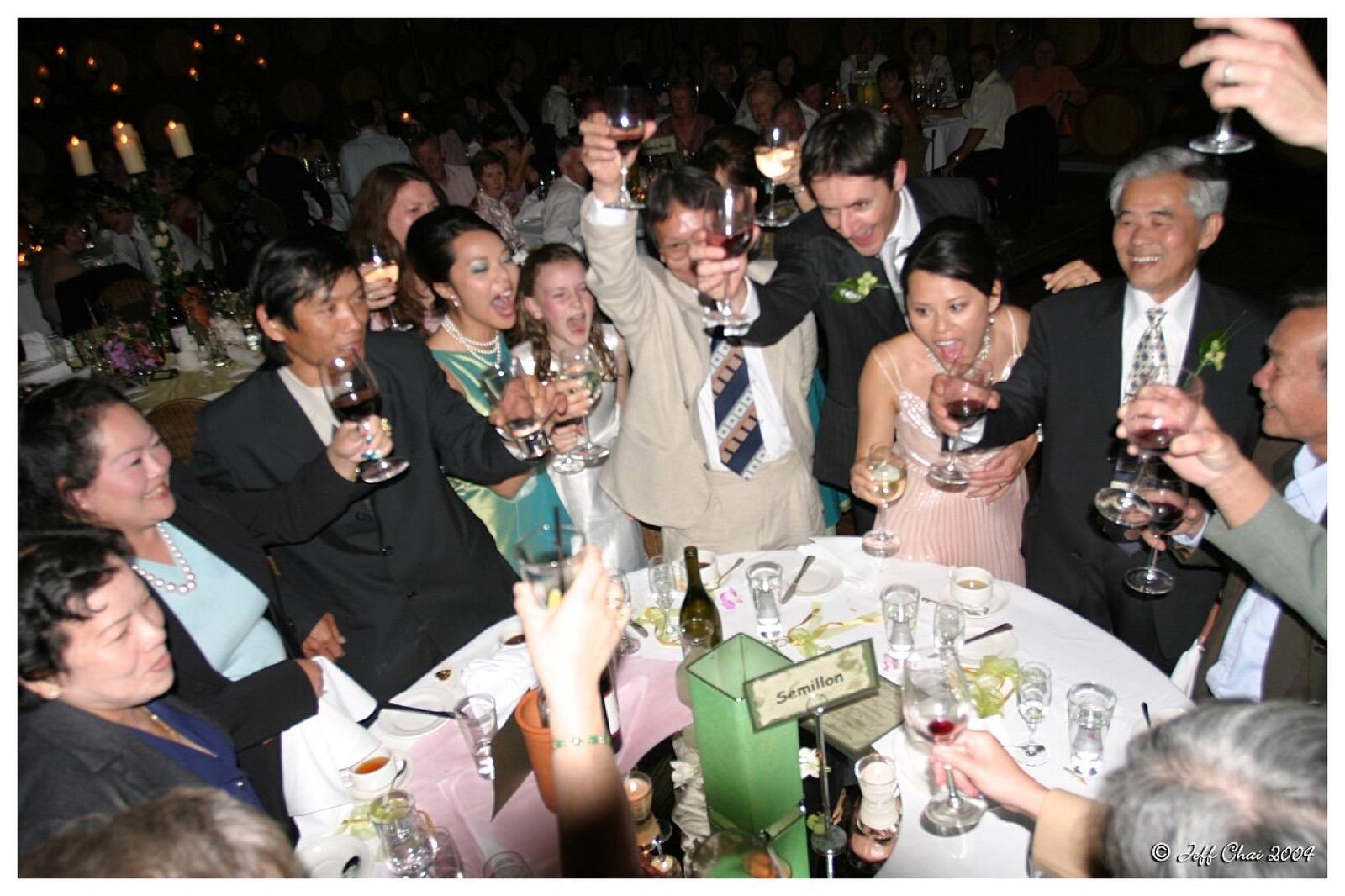 Guests raising glasses at a wedding table