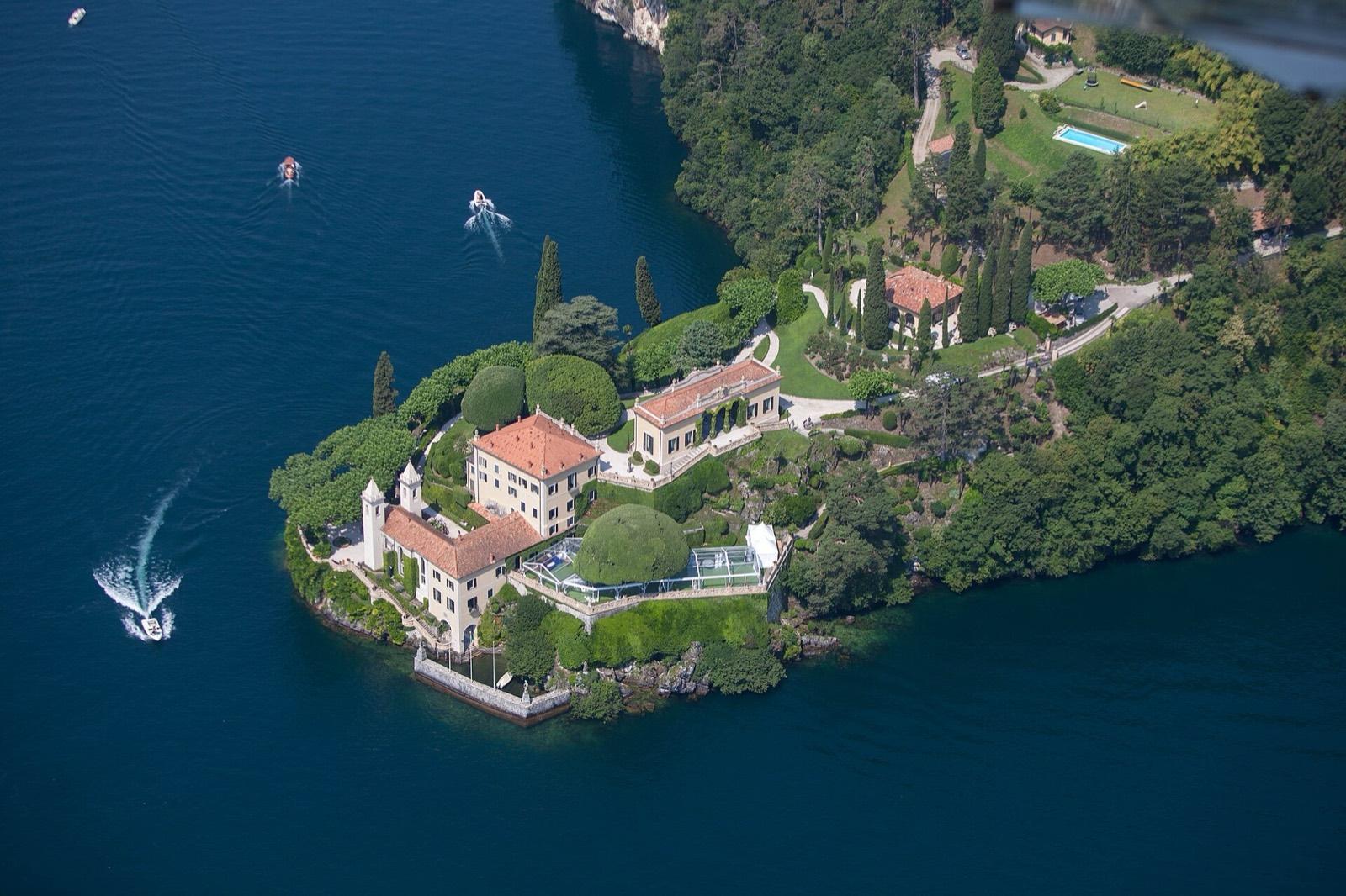 Villa del Balbianello on its wooded point in Lake Como, seen from above